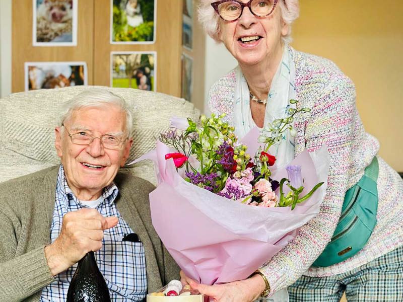 Glencairn rsidents Gavin And Olive exchange gifts - chocolate, prosecco, and flowers for Valentines day. 