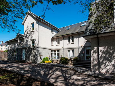 Torry Care Home Exterior: A white and grey building 