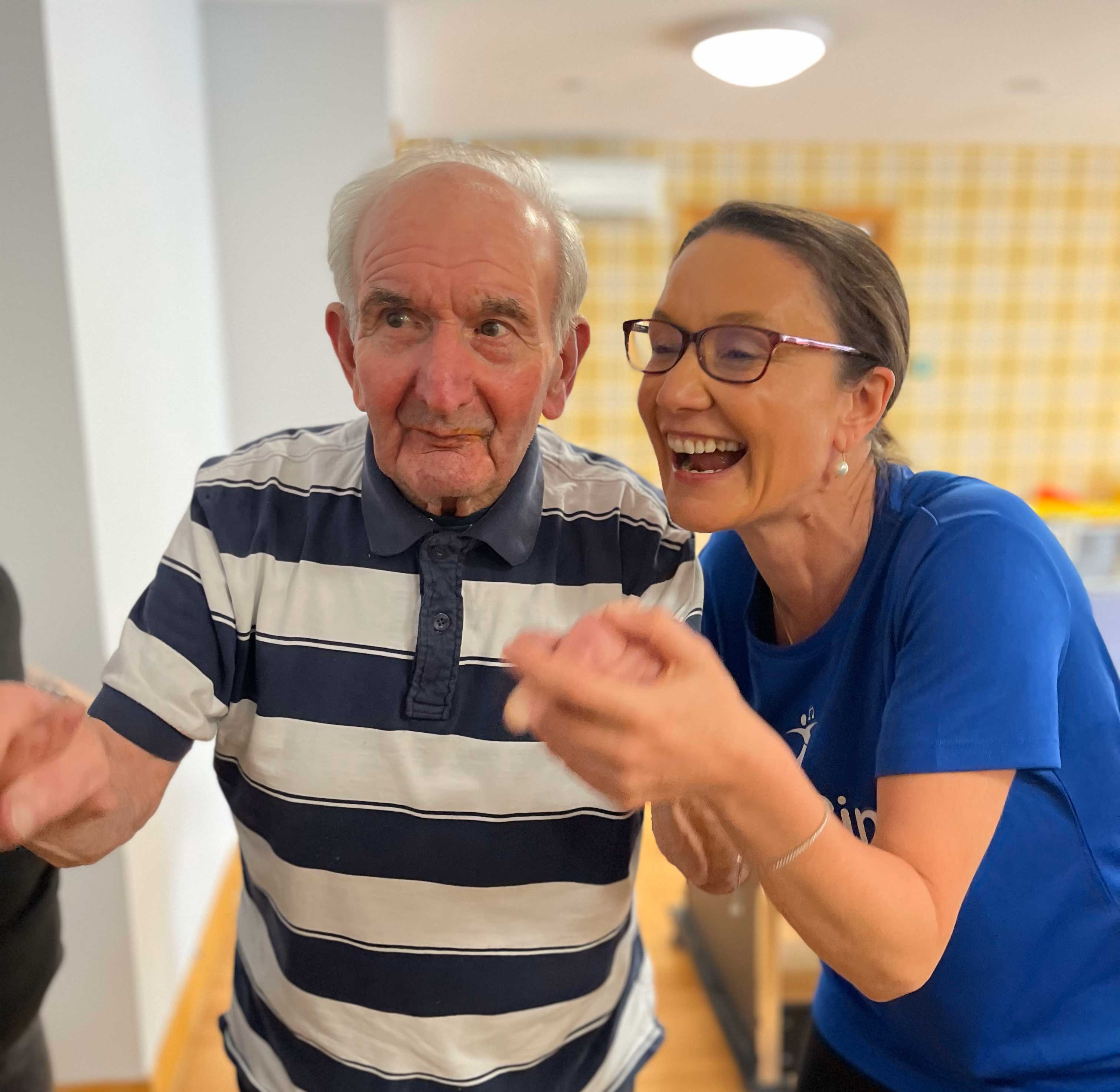 A resident enjoys a dance with danceSing Rep Natalie