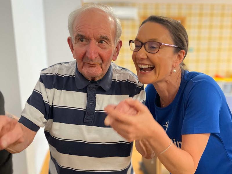 A resident enjoys a dance with danceSing Rep Natalie