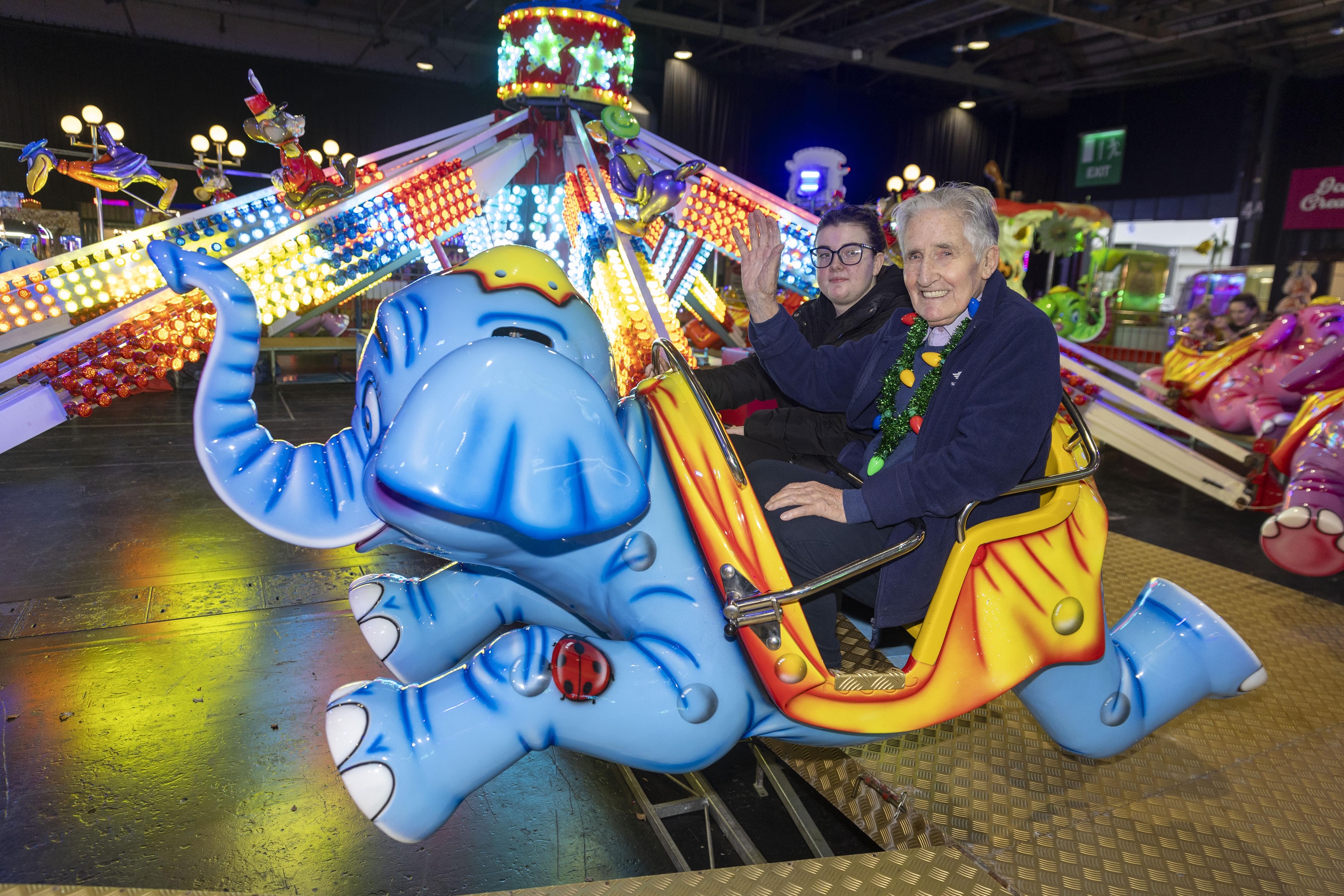 Student Care Assistant, and Whitecraigs Care Home; Iain Harris 91, on a ride at the Irn-Bru Carnival 