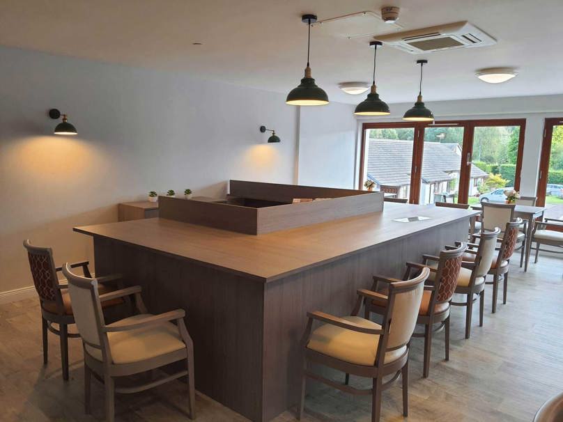 Beech Manor Care Home Communal Dining Space Open Plan Kitchen Island with Surrounding Chairs 