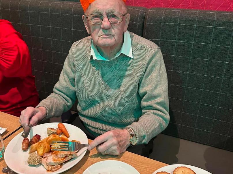 Resident Fred, 104, enjoying a Christmas Dinner