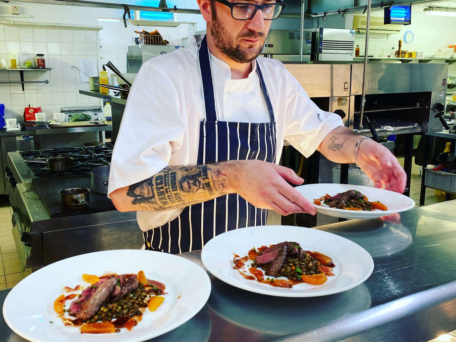 Malin Court Chef Lee Preparing Pigeon Dish in the Homes Kitchen