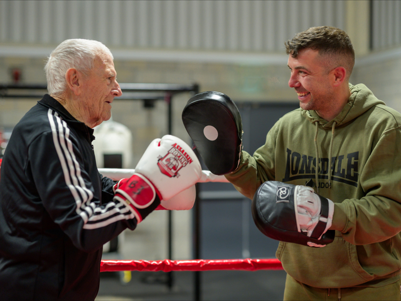 A care home resident completes his wish of sparring with local professional boxer 